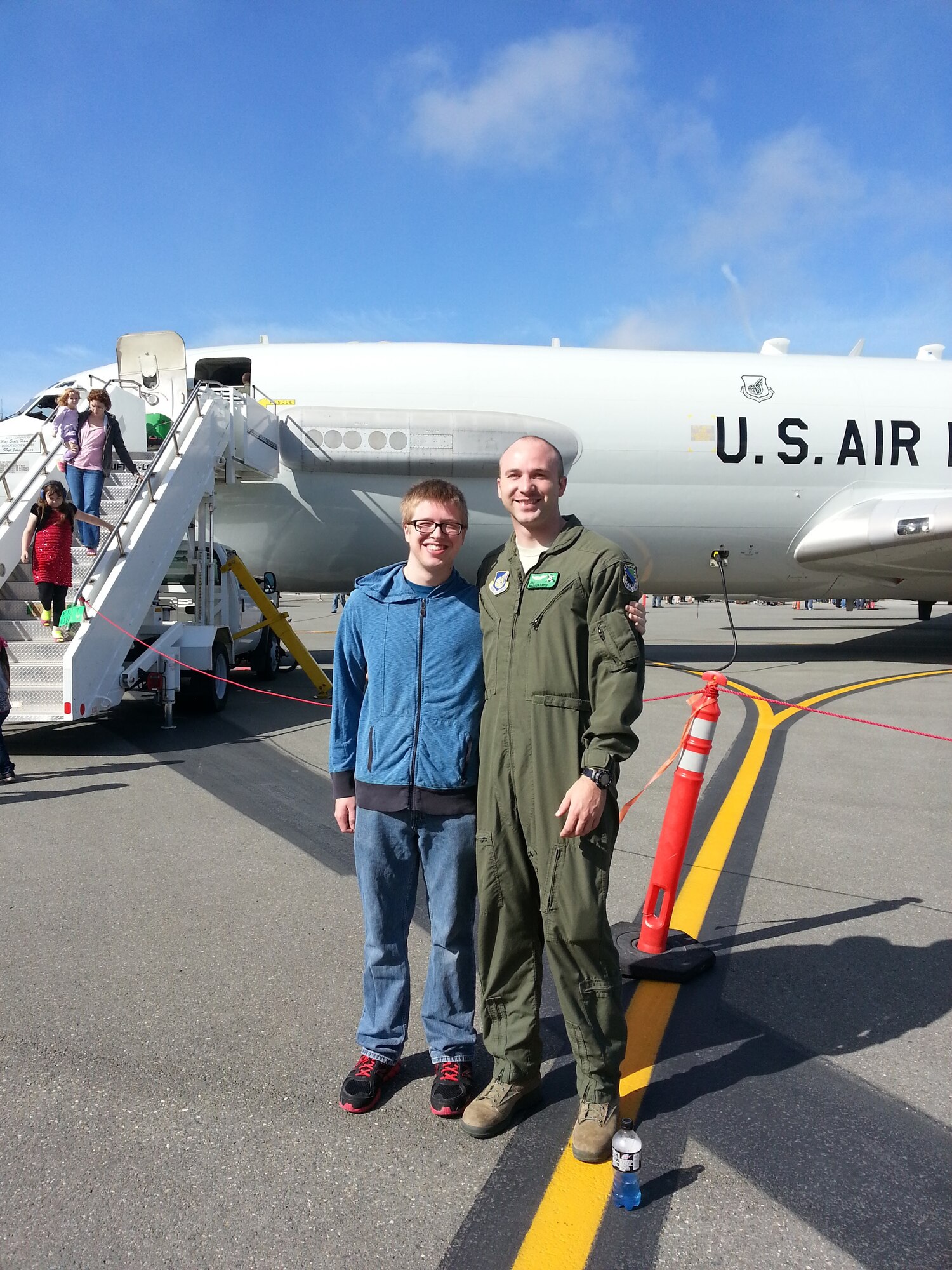 Senior Airman Madison Hayes, 962nd Airborne Air Control Squadron E-3 Sentry airborne mission systems specialist, poses for a photo with his brother Benjamin Hayes at the 3rd Wing Airshow at Joint Base Elmendorf-Richardson, Alaska, July 2014.