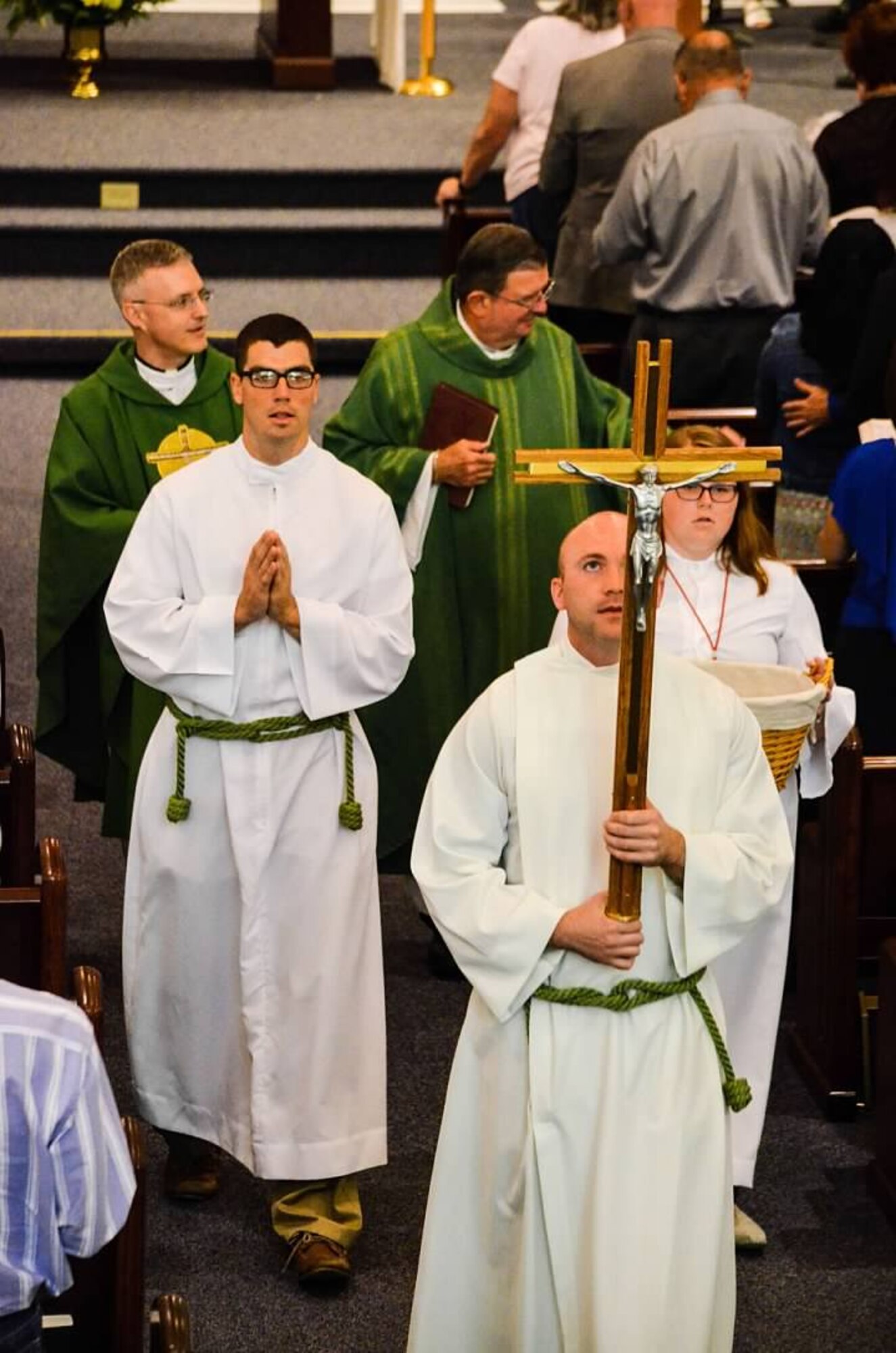2nd. Lt. Madison Hayes, Air Force Reserve Command chaplain candidate, serves as an Acolyte for Catholic Mass during the Chaplain Candidate Intensive Internship program at Robins Air Force Base, Georgia, July 2016