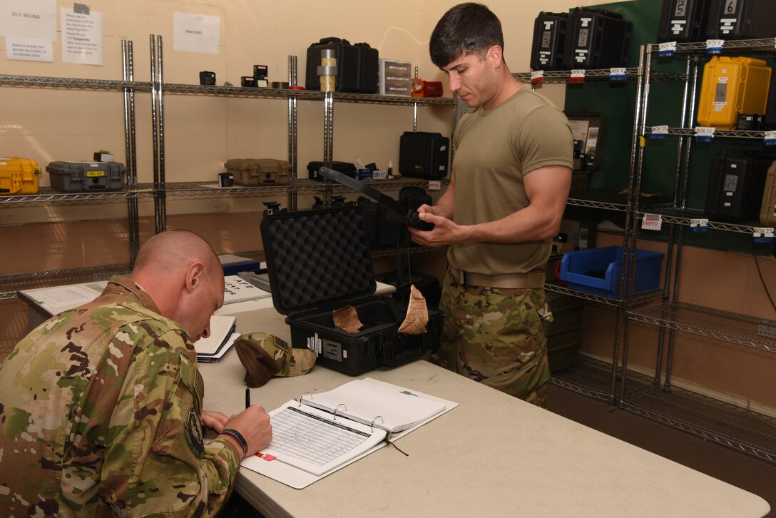Tech. Sgt. Kevin Ray, 28th Expeditionary Air Refueling Squadron aircrew flight equipment flight chief, signs out a radio to a customer at Al Udeid AB, Qatar, June 1, 2019. The 385th AEG makes it possible to deliver supplies, people, fuel, and combat airpower anywhere in the AOR at a moment’s notice. (U.S. Air Force photo by Staff Sgt. Ashley L. Gardner)
