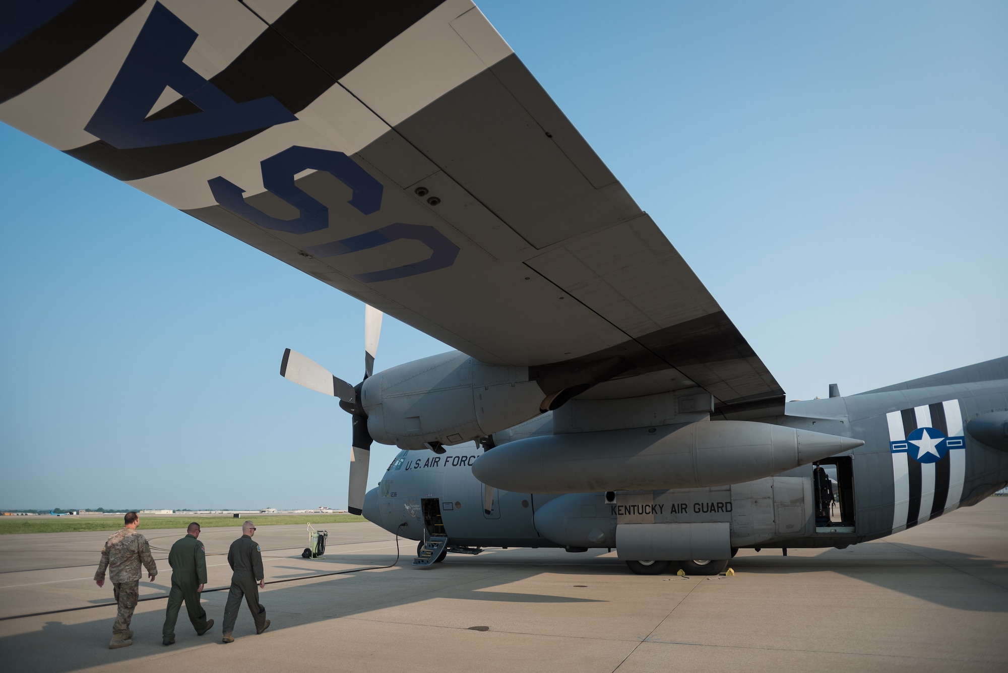 Members of the 123rd Airlift Wing board a C-130 Hercules aircraft at the Kentucky Air National Guard Base in Louisville, Ky., June 1, 2019, en route to France, where they will participate in the 75th-anniversary reenactment of D-Day. Two Kentucky C-130s will airdrop U.S. Army paratroopers over Normandy on June 9 as part of the commemoration. The aircraft has been striped with historically accurate Allied Forces livery in honor of the event, which turned the tide of World War II in the European theater. (U.S. Air National Guard photo by Dale Greer)