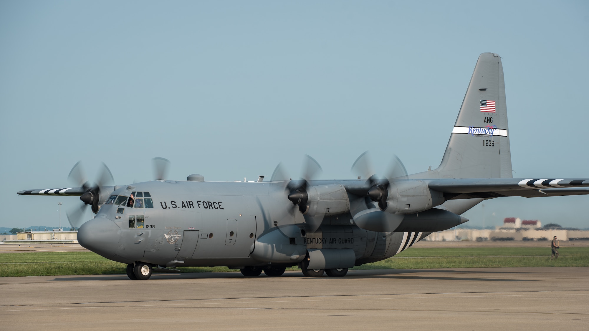 A 123rd Airlift Wing C-130 Hercules taxies from the Kentucky Air National Guard base in Louisville, Ky., June 1, 2019, en route to France, where it will participate in the 75th-anniversary reenactment of D-Day. The aircraft, which has been striped with historically accurate Allied Forces livery, will airdrop U.S. Army paratroopers over Normandy on June 9 as part of the commemoration. The D-Day invasion, formally known as Operation Overlord, turned the tide of World War II in the European theater. (U.S. Air National Guard photo by Dale Greer)