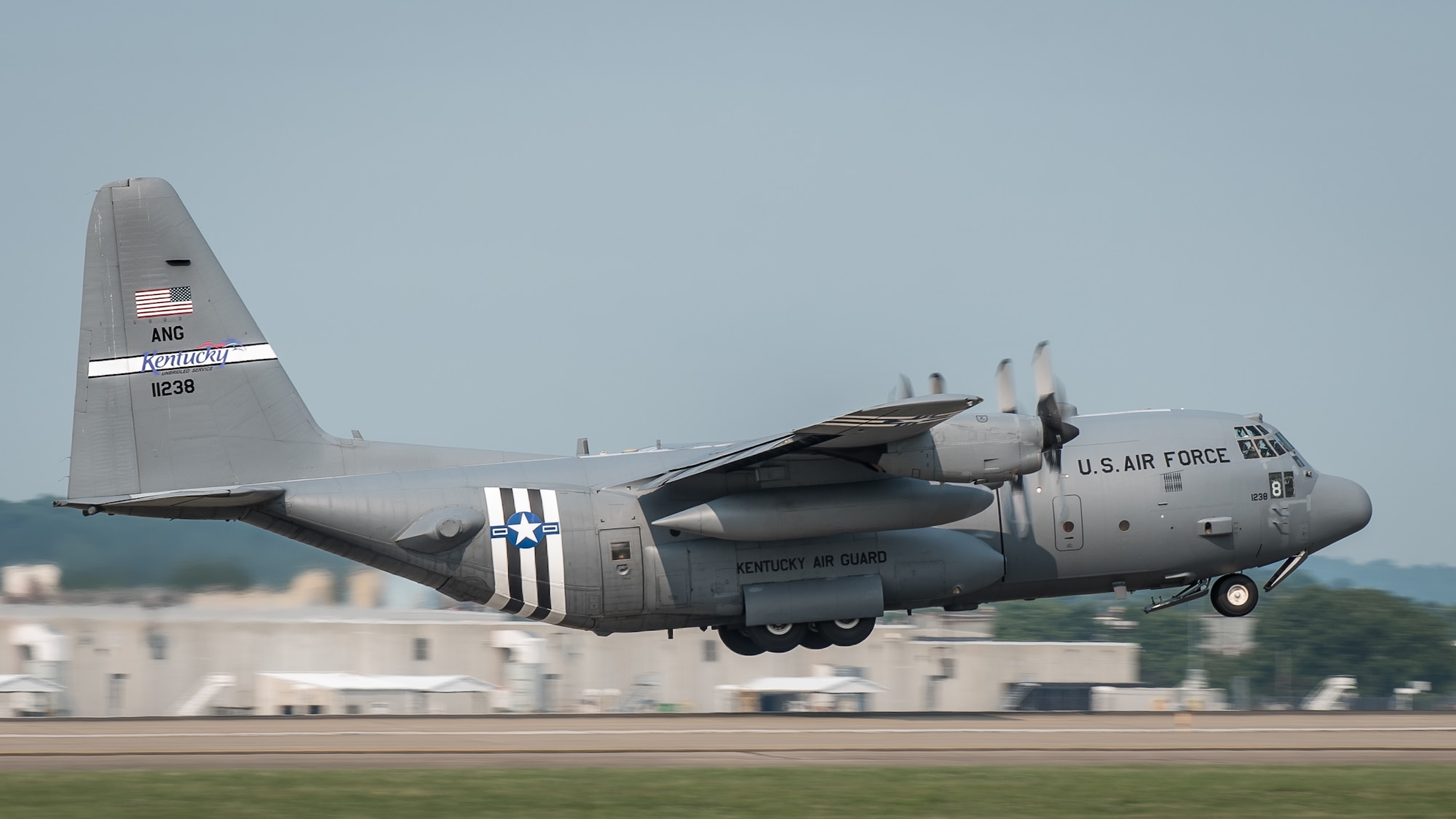 A 123rd Airlift Wing C-130 Hercules takes off from the Kentucky Air National Guard base in Louisville, Ky., June 1, 2019, en route to France, where it will participate in the 75th-anniversary reenactment of D-Day. The aircraft, which has been striped with historically accurate Allied Forces livery, will airdrop U.S. Army paratroopers over Normandy on June 9 as part of the commemoration. The D-Day invasion, formally known as Operation Overlord, turned the tide of World War II in the European theater. (U.S. Air National Guard photo by Dale Greer)