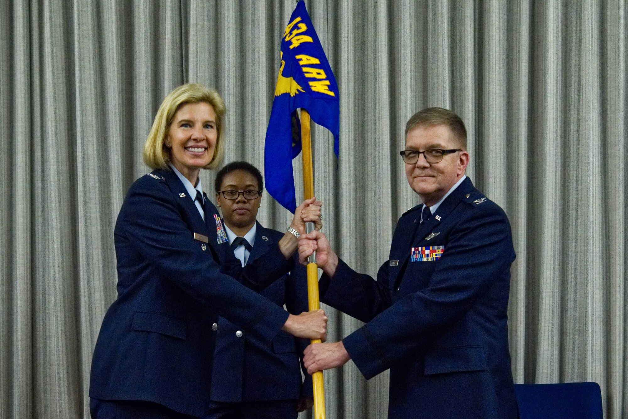 Col. Gregory Pinnell, 434th Aerospace Medicine Squadron commander, accepts the guidon from Col. Anne Noel, 434th Air Refueling Wing vice commander, at a change of command ceremony at Grissom Air Reserve Base, Indiana, June 1, 2019. Pinnell is filling the position left by the previous AMDS commander, Lt. Col. Pete Weber. (U.S. Air Force photo / Airman 1st Class Harrison Withrow)