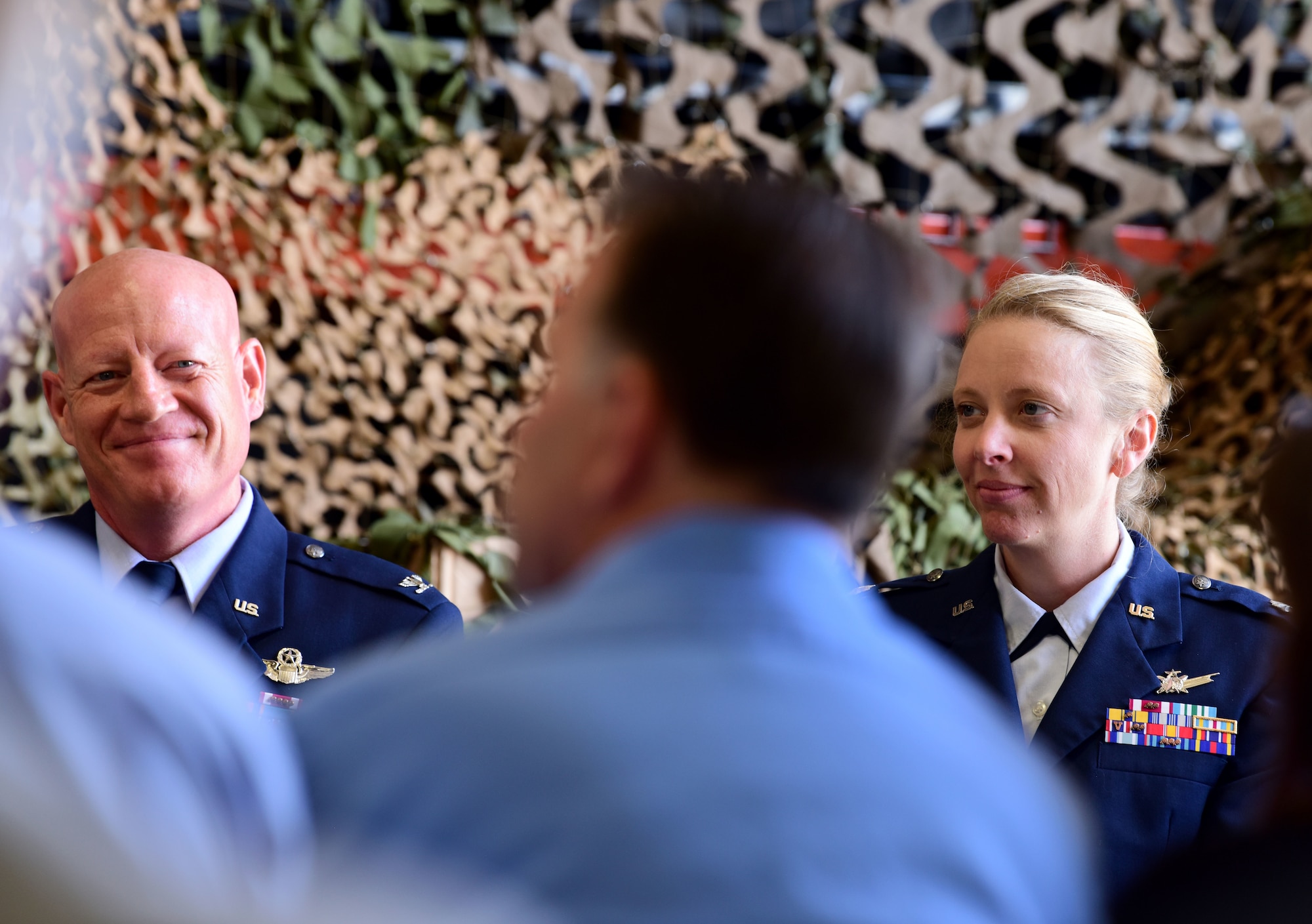 Col. Todd Tobergte, 926th Operations Group commander, sits adjacent to Lt. Col. Laura Kohake, outgoing 26th Space Aggressor Squadron commander, during a ceremony June 1, 2019.