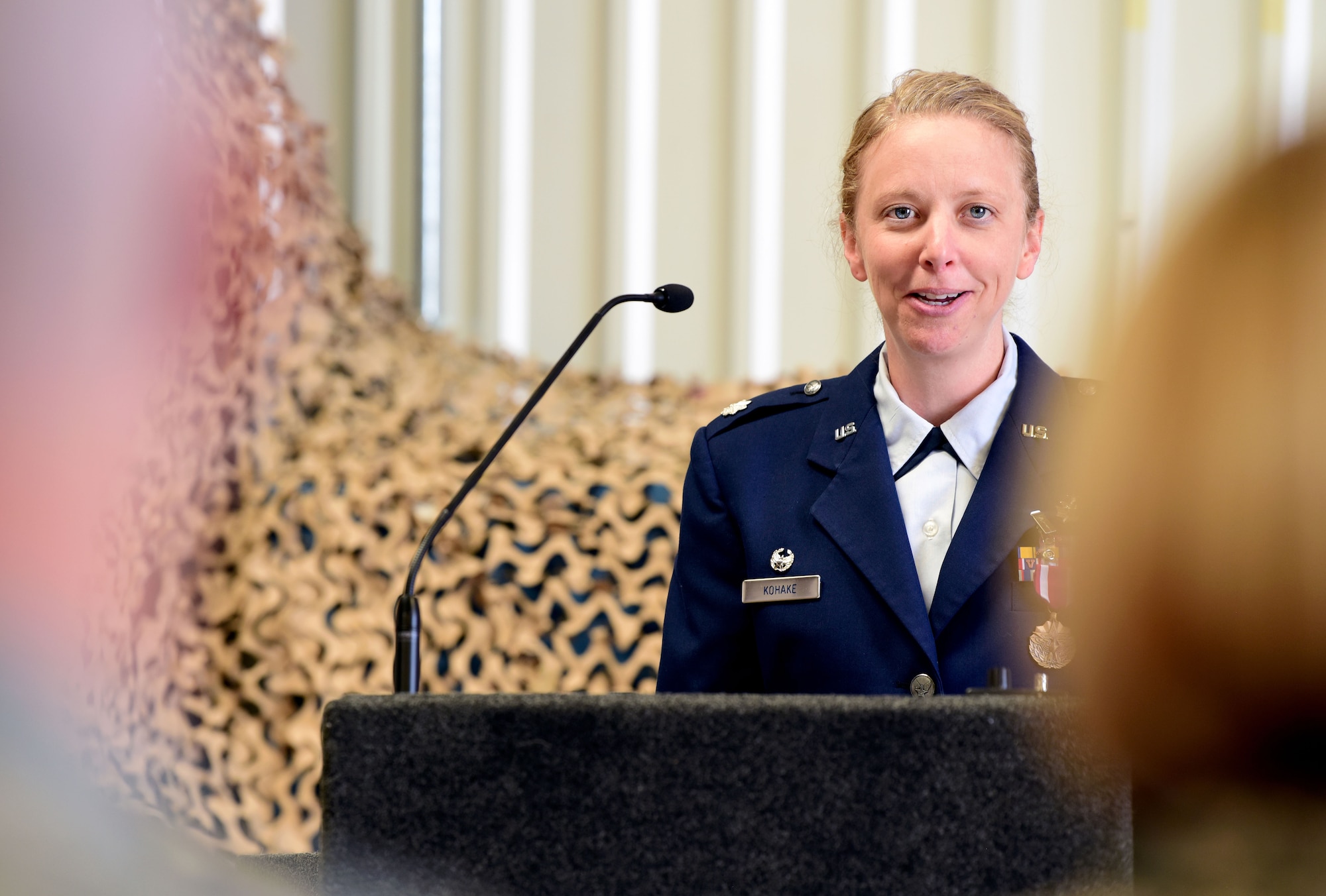 Lt. Col. Laura Kohake, outgoing 26th Space Aggressor Squadron commander, addresses the men and women of the 26 SAS for the last time during a ceremony June 1, 2019.