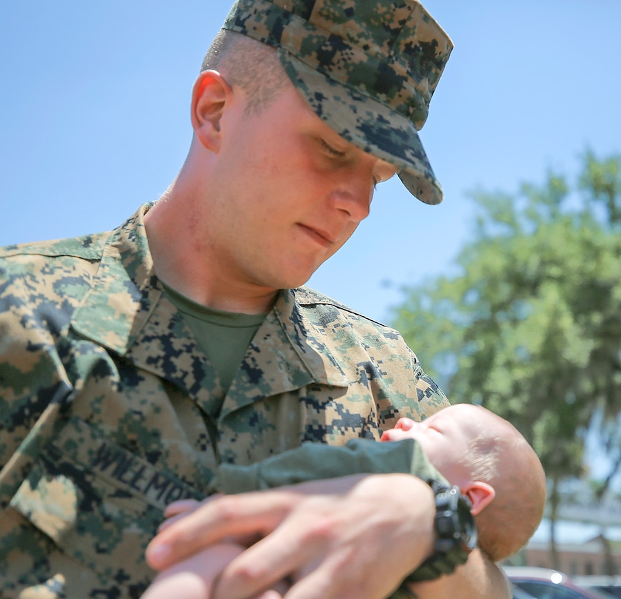 Pvt. Hunter Willmon, a Scottsboro, Ala. native, held his son for the first time on Family Day, May 26. Willmon graduated today from recruit training.