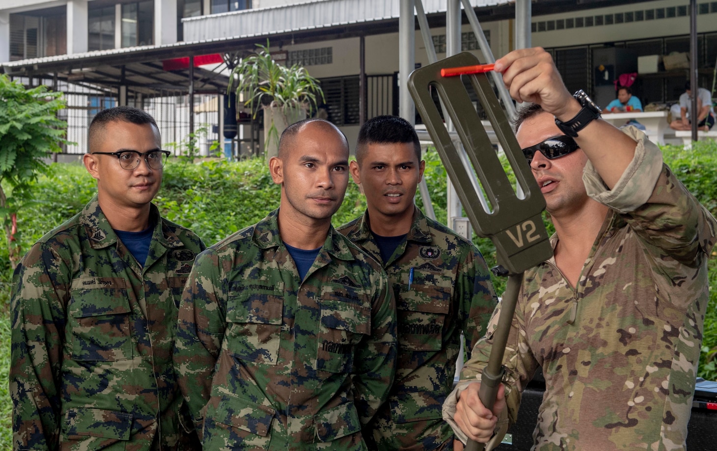 190531-N-RM689-1093 SATTAHIP NAVAL BASE, Thailand (May 31, 2019) Explosive Ordnance Disposal Technician 2nd Class Luke Ostrowski, assigned to U.S. Navy Explosive Ordnance Disposal Mobile Unit (EODMU) 5, demonstrates the sensitivity of a metal detector to members of the Royal Thai Navy Diver and Explosive Ordnance Disposal Center during a knowledge exchange as part of Cooperation Afloat Readiness and Training (CARAT) Thailand 2019. This year marks the 25th iteration of CARAT, a multinational exercise series designed to enhance U.S. and partner navies' abilities to operate together in response to traditional and non-traditional maritime security challenges in the Indo-Pacific region.