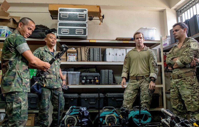 190531-N-RM689-1050 SATTAHIP NAVAL BASE, Thailand (May 31, 2019) Explosive ordnance disposal technicians assigned to U.S. Navy Explosive Ordnance Disposal Mobile Unit (EODMU) 5 and the Royal Thai Navy Diver and Explosive Ordnance Disposal Center conduct an equipment demonstration during a knowledge exchange as part of Cooperation Afloat Readiness and Training (CARAT) Thailand 2019. This year marks the 25th iteration of CARAT, a multinational exercise series designed to enhance U.S. and partner navies' abilities to operate together in response to traditional and non-traditional maritime security challenges in the Indo-Pacific region.