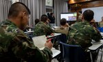 190531-N-RM689-1025 SATTAHIP NAVAL BASE, Thailand (May 31, 2019) Royal Thai Navy Petty Officer 1st Class Chaiwat Chaisut, assigned to the Royal Thai Navy Diver and Explosive Ordnance Disposal Center, takes notes during a knowledge exchange about different types of explosives and disposal techniques as part of Cooperation Afloat Readiness and Training (CARAT) Thailand 2019. This year marks the 25th iteration of CARAT, a multinational exercise series designed to enhance U.S. and partner navies' abilities to operate together in response to traditional and non-traditional maritime security challenges in the Indo-Pacific region.