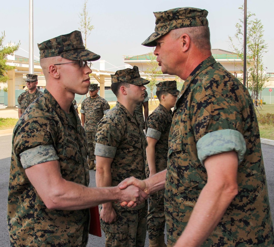 CAMP HUMPHREYS, Republic of Korea – Sgt. Robert Barrette, U.S. Marine Corps Forces Korea G6 helpdesk chief, was promoted to his current rank and simultaneously awarded the Navy and Marine Corps Achievement Medal and a Certificate of Commendation here, June 3rd. Barrett was awarded the Navy and Marine Corps Achievement Medal for his outstanding devotion to duty as a member of the MARFORK G6, and received a Certificate of Commendation for winning NCO of the quarter. (Official U.S. Marine Corps photo by 1stLt. Edward Pingel/Released)