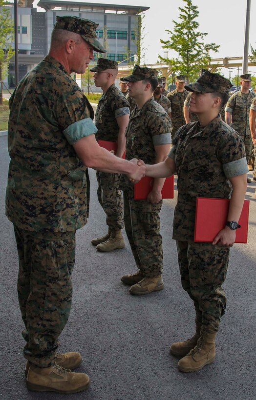CAMP HUMPHREYS, Republic of Korea – Lance Cpl. Maria NavarroGarcia, U.S. Marine Corps Forces Korea G1 administrative specialist, is promoted to her current rank here, June 3rd. MARFORK is NavarroGarcia’s first unit, where she is learning from peers and leaders alike. Her promotion charges her with using her growing knowledge to lead and mentor her subordinates in her current and follow-on units. (Official U.S. Marine Corps photo by 1stLt. Edward Pingel/Released)