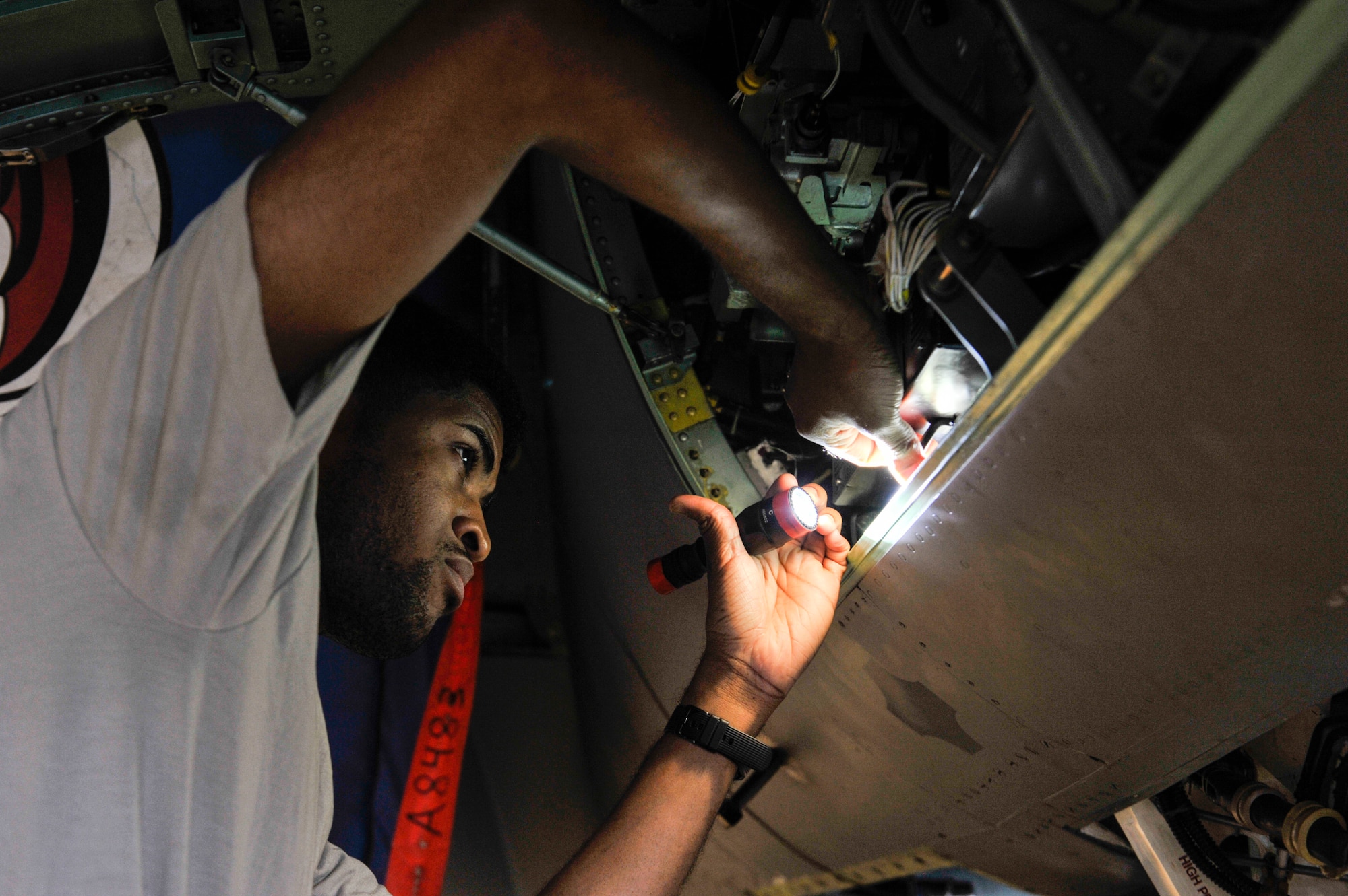 U.S. Air Force Senior Airman Markeith Middleton, crew chief assigned to the 18th Equipment Maintenance Squadron, inspects an F-15 Eagle during phase maintenance at Kadena Air Base, Japan, May 15, 2019.