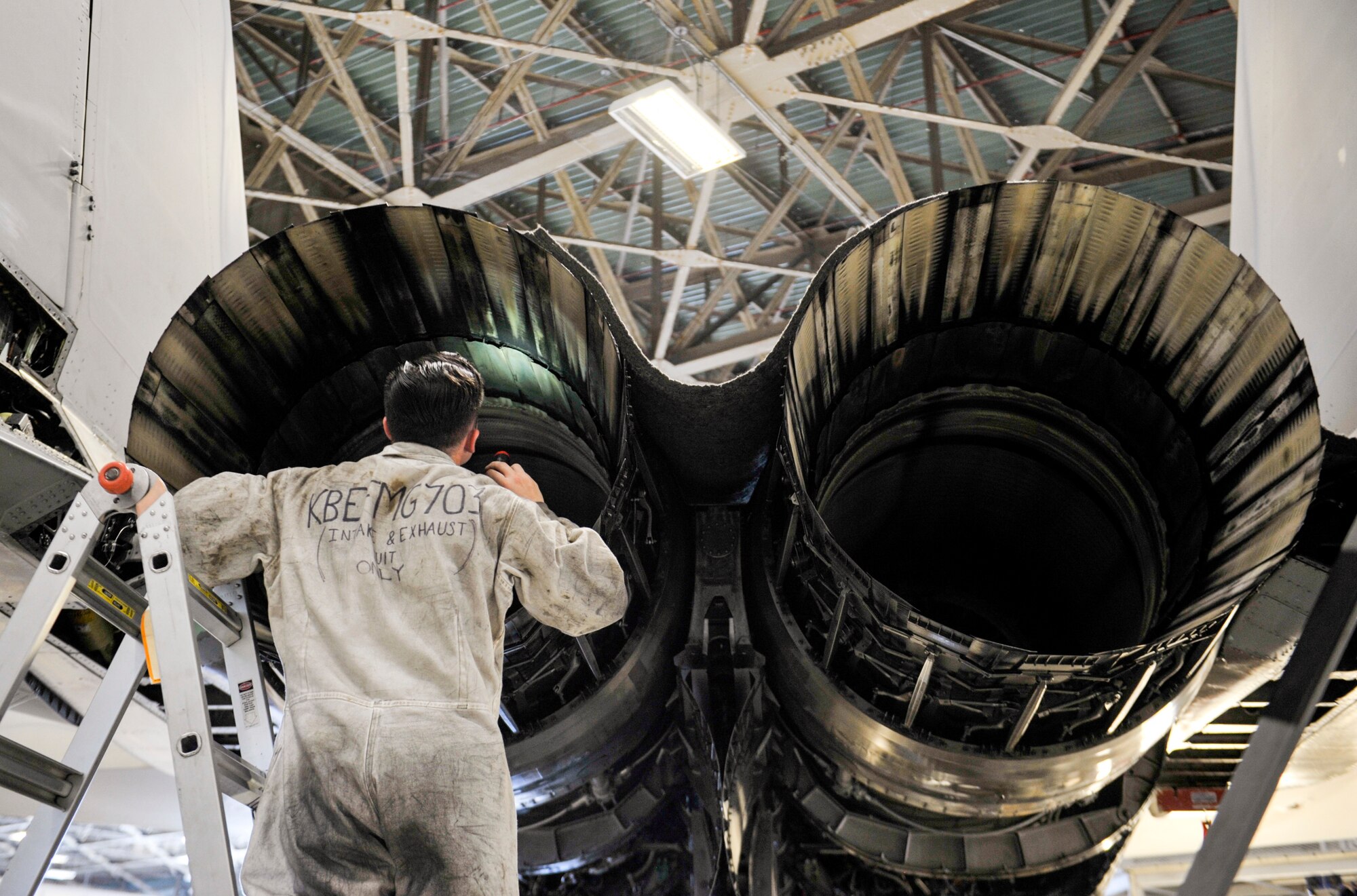U.S. Air Force Airman 1st Class Shawn McMahon, engine specialist assigned to the 44th Air Maintenance Unit, inspects the inside of an F-15 Eagle during phase maintenance at Kadena Air Base, Japan, May 15, 2019.