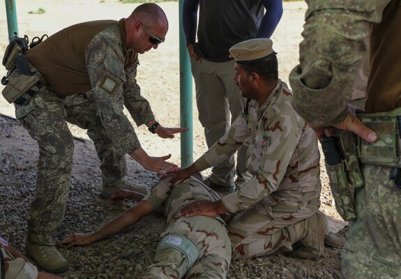 A New Zealand soldier with Task Group Taji 8 instructs tactical field care techniques, on Camp Taji, Iraq, May 6, 2019. Combined Joint Task Force – Operation Inherent Resolve focuses on providing training, support, and equipment to enhance the professionalism, technical expertise and equipment capabilities of Iraqi Security Forces. This will enable the ISF to counter future external and internal threats independently and establish permanent security across the country. (Portions of this photo have been blurred to protect operational security).