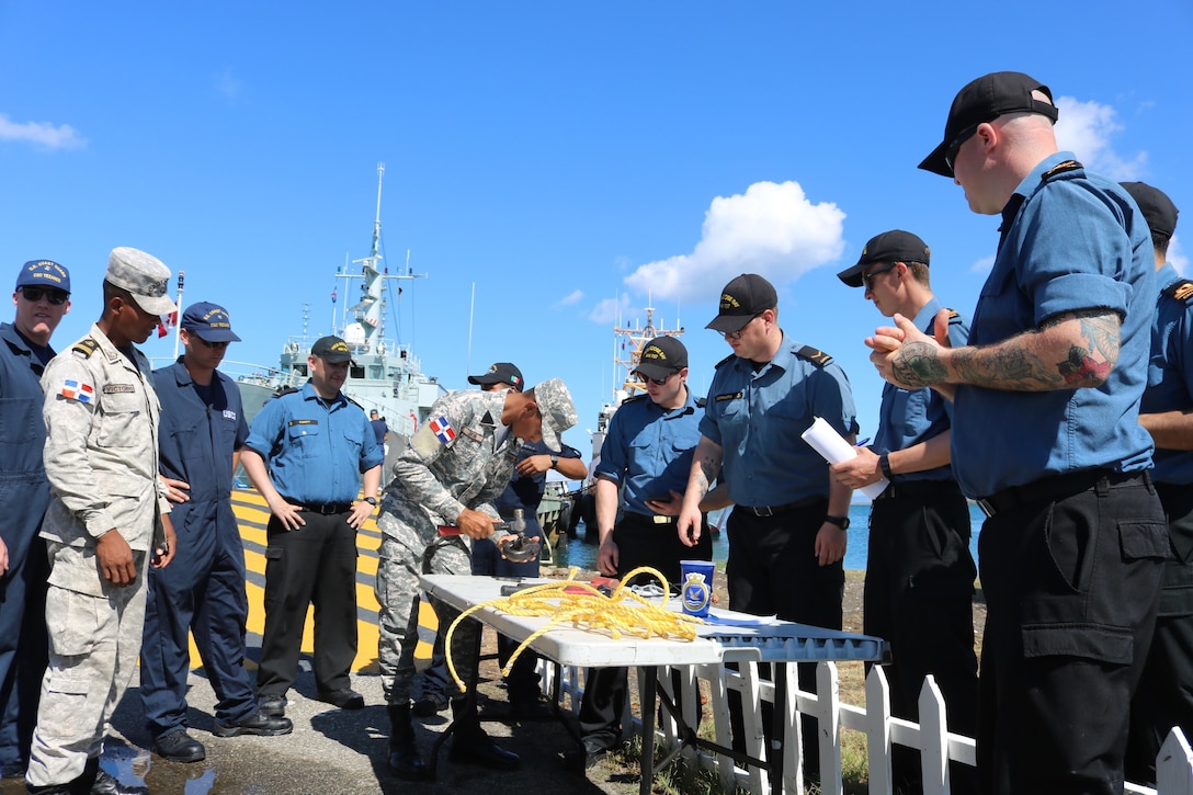 A Dominican Naval member competes in the Seamanship Olympics at Tradewinds 2019.