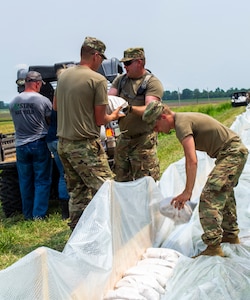 Soldiers are placing sandbags along the Winchester levee system