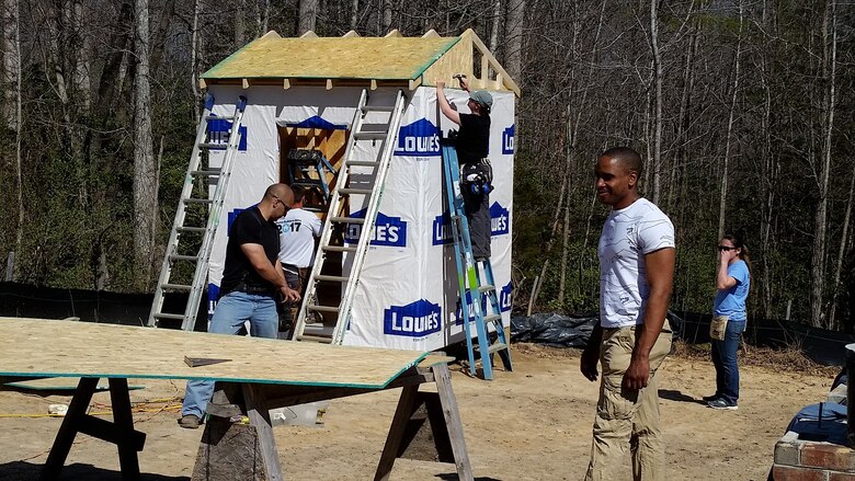 Seven Airmen from the 718th Intelligence Squadron helped build three homes for Habitat for Humanity. They installed roofing, built frameworks, put up sheetrock, completed siding work, and did work on metal trimming.