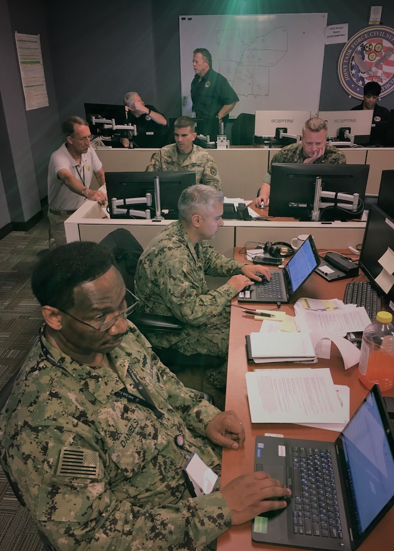 Joint Task Force Civil Support (JTF-CS) Crisis Action Team (CAT) members participate in a scenario during the national-level exercise Ardent Sentry 2019. During the exercise, which is scheduled to run from May 29 - June 5, nearly 100 JTF-CS personnel supported more than 50 command members who were forward-deployed to Nashville, Tenn.; Berry Field, Tenn.; Jackson, Miss.; Jefferson City, Mo. and Ft. Sam Houston, Tx. in response to a notional 7.7 magnitude earthquake in the New Madrid Seismic Zone (NMSZ). Ardent Sentry is a U.S. Northern Command exercise geared toward building and strengthening interagency relationships by providing defense support of civil authorities during the NMSZ earthquake scenario. (U.S. Air Force photo by Lt. Col. Karen Roganov/RELEASED)