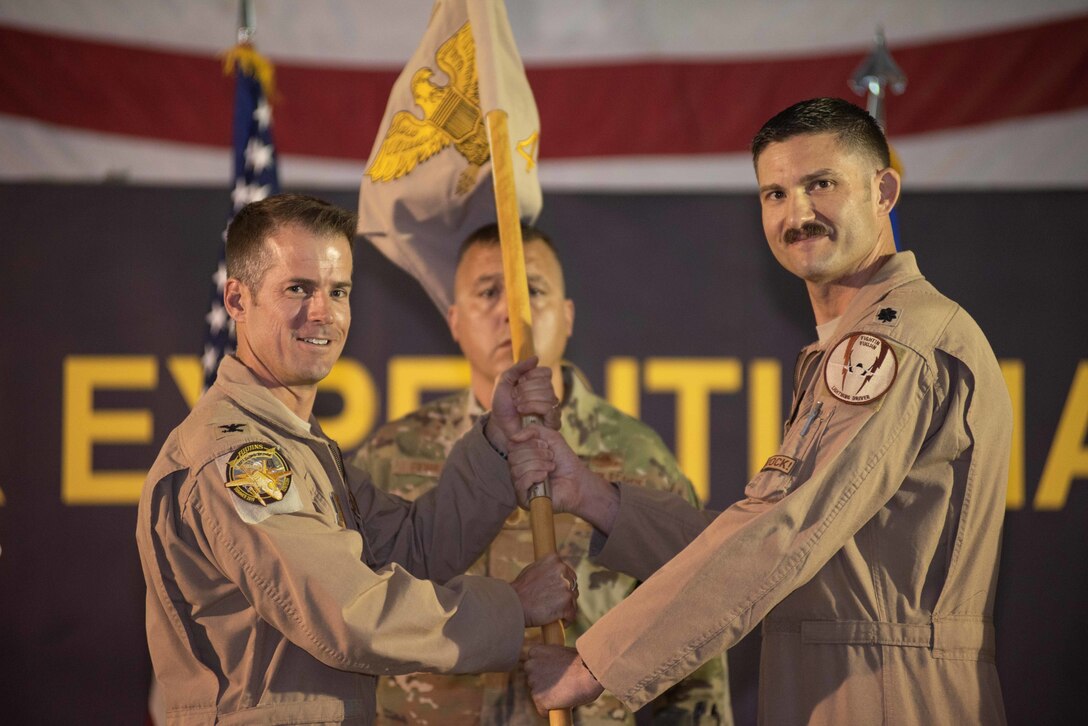 Lt. Col. Yosef Morris, right, relinquishes command of the 4th Expeditionary Fighter Squadron May 30, 2019 at Al Dhafra Air Base, United Arab Emirates. Morris served as the commander during the beginning of the F-35A Lightning II squadron’s first deployment to the Middle East. (U.S. Air Force photo by Staff Sgt. Chris Thornbury)