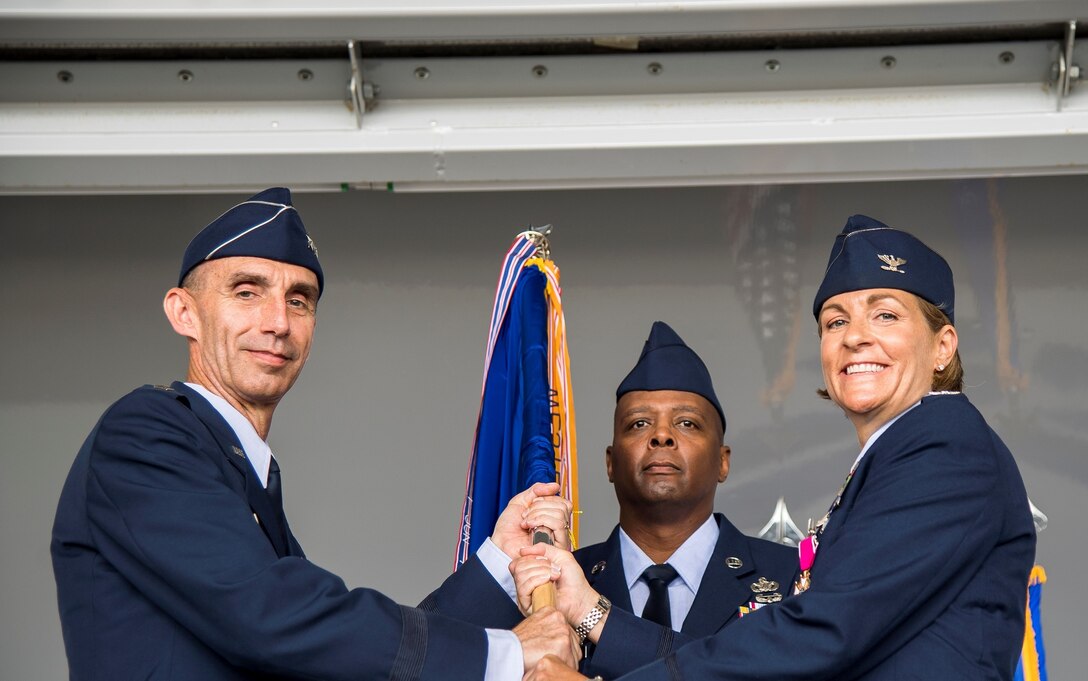Maj. Gen. Scott Zobrist, 9th Air Force commander, receives the 23d Wing guidon from Col. Jennifer M. Short, 23d Wing commander, as she relinquishes command during the 23d Wing change of command ceremony, May 31, 2019, at Moody Air Force Base, Ga. The ceremony is a military tradition that represents a formal transfer of a unit’s authority and responsibility from one commander to another. Short will depart Moody AFB to serve as the Executive Assistant to the commander, Pacific Air Force, Joint Base Pearl Harbor-Hickam, Hawaii. (Courtesy Photo)