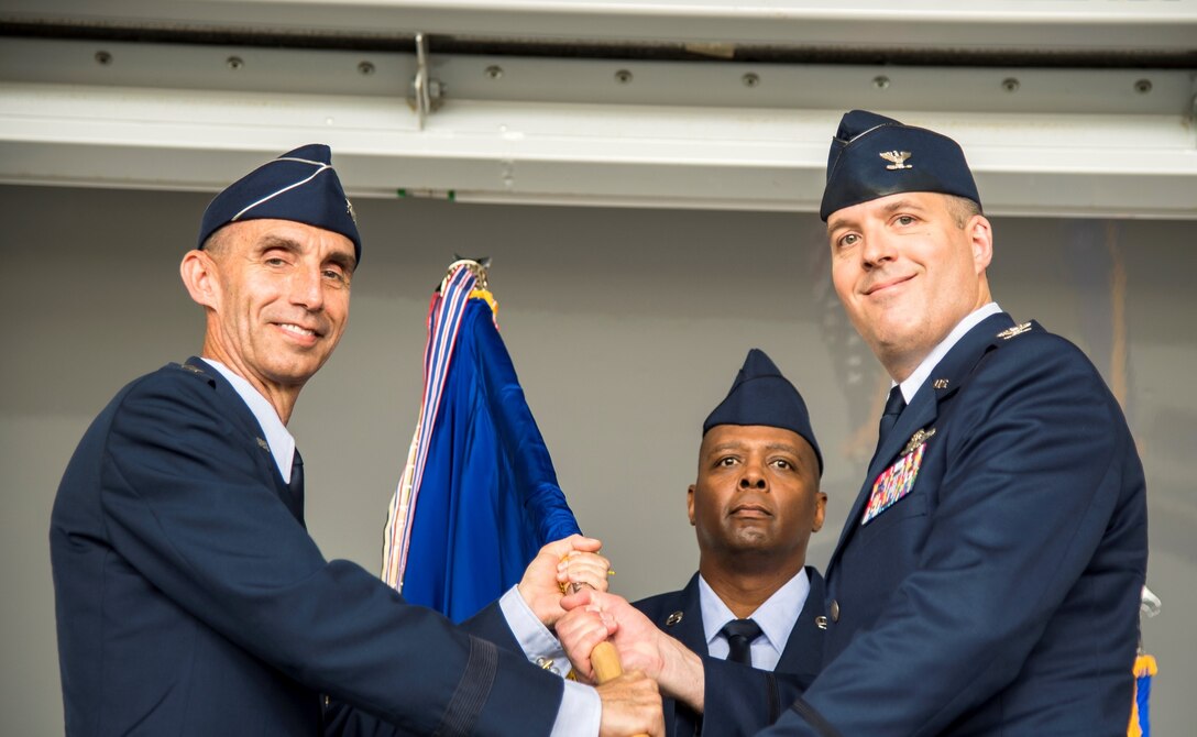 Maj. Gen. Scott Zobrist, 9th Air Force commander, presents the 23d Wing guidon to Col. Daniel P. Walls, 23d Wing commander, as he assumes command during the 23d Wing change of command ceremony, May 31, 2019, at Moody Air Force Base, Ga. The ceremony is a military tradition that represents a formal transfer of a unit’s authority and responsibility from one commander to another. Walls is coming from Osan Air Base, Republic of Korea, where he served as the commander for the 51st Operations Group for the 51st Fighter Wing. He has an extensive resume that includes over 3,000 flying hours with various units including the 74th and 75th Fighter Squadrons. (Courtesy Photo)