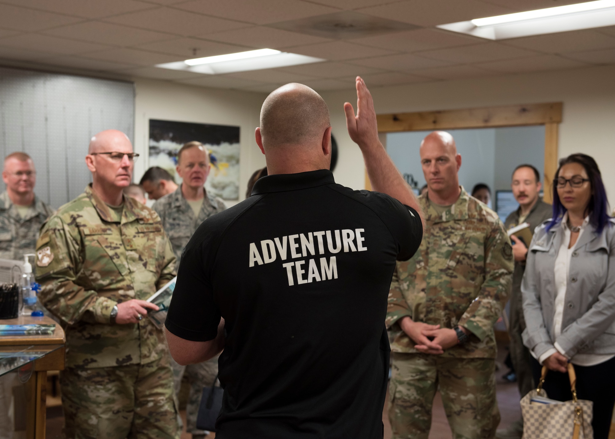 Damian Smith, 92nd Force Support Squadron Outdoor Recreation director, leads Maj. Gen. Sam Barrett, 18th Air Force commander, and Chief Master Sgt. Chris Simpson, 18th AF command chief, on a tour of the facility during a base visit May 22, 2019 at Fairchild Air Force Base, Washington. Eighteenth AF leaders took a keen interest in how the facility provides Airmen healthy means to unwind during off-duty hours to achieve work-life balance. (U.S. Air Force photo by Senior Airman Ryan Lackey)