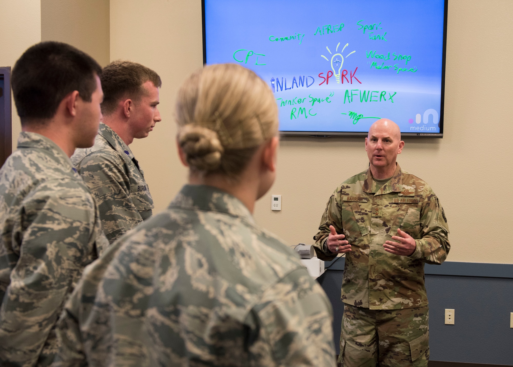 Maj. Gen. Sam Barrett, 18th Air Force commander, talks with Reserve Officer Training Corps cadets while visiting the base’s new Inland Spark thinker space during a base visit May 22, 2019 at Fairchild Air Force Base, Washington. The thinker space is part of an Air Force-wide initiative to develop an innovative culture so Airmen can develop ideas to assist workflow, increase efficiency and invent new technologies to keep the U.S. military ahead of evolving global challenges. (U.S. Air Force photo by Senior Airman Ryan Lackey)