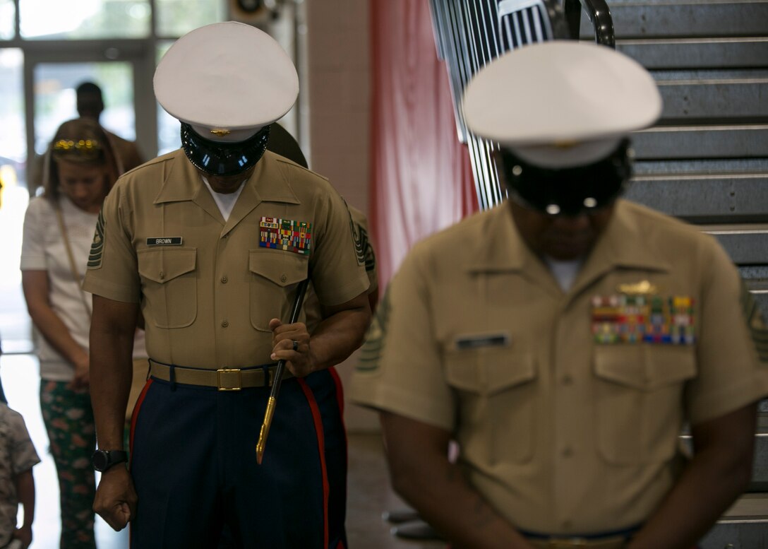 Sgt. Maj. Cortez L. Brown, left, and Sgt. Maj. William J. Banks III, right, participate in a 6th Marine Corps District Relief and Appointment ceremony at the All Weather Training Facility aboard Marine Corps Recruit Depot Parris Island, South Carolina on 31 May, 2019. Sgt. Maj. Brown was relieved of the duties as the 6th District Sergeant Major by Sgt. Maj. Banks III. (U.S. Marine Corps Photo by Cpl. Jack A. E. Rigsby)