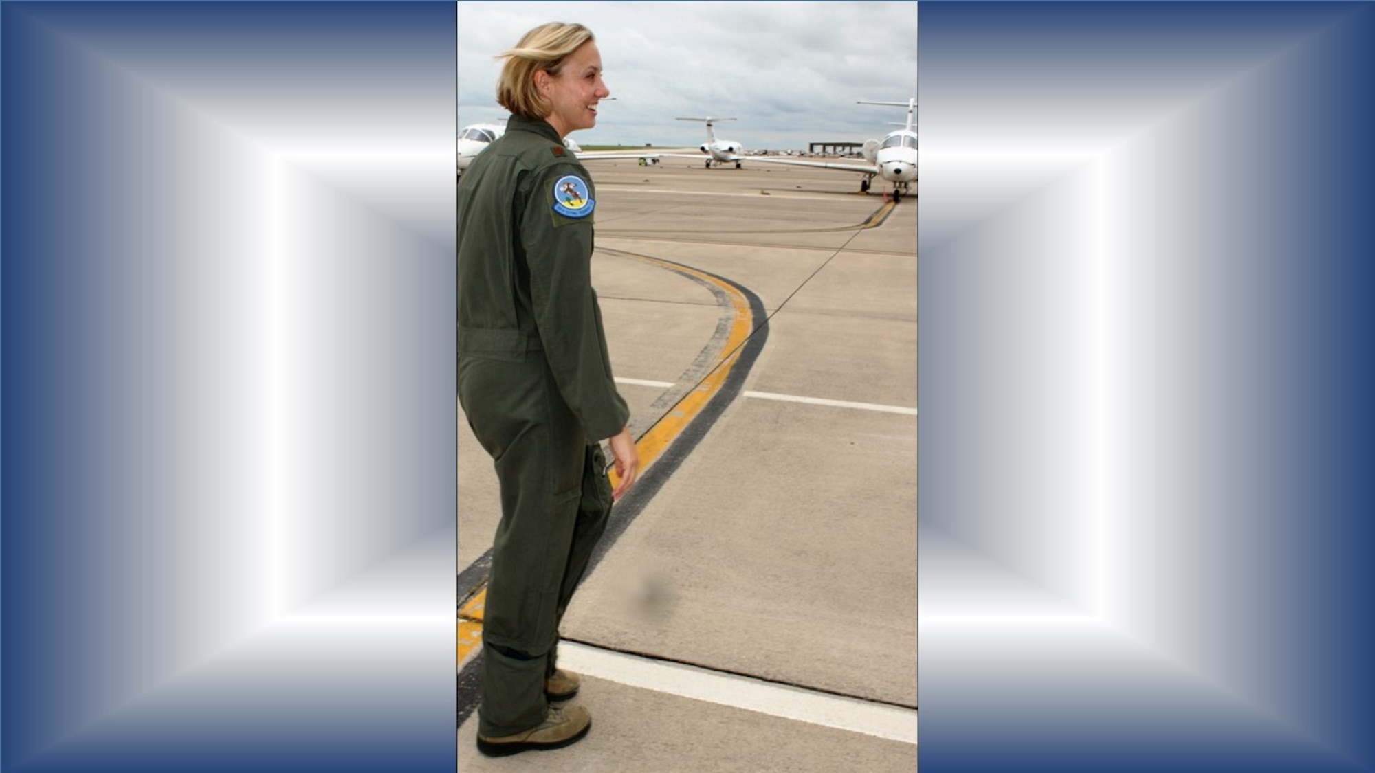 Air Force Reserve Citizen Airman Maj. Hilary Foley, 96th Flying Training Squadron T-1 Jayhawk instructor pilot, Laughlin Air Force Base, Texas, heads for ‘her’ Jayhawk to give a quick tour of its interior. As a former active duty C-5 pilot, current Reserve instructor pilot and wife of an active duty squadron commander, Foley has the perfect experience and background to help “bridge the gap” between active and Reserve teammates and families. (U.S. Air Force photo by Debbie Gildea)