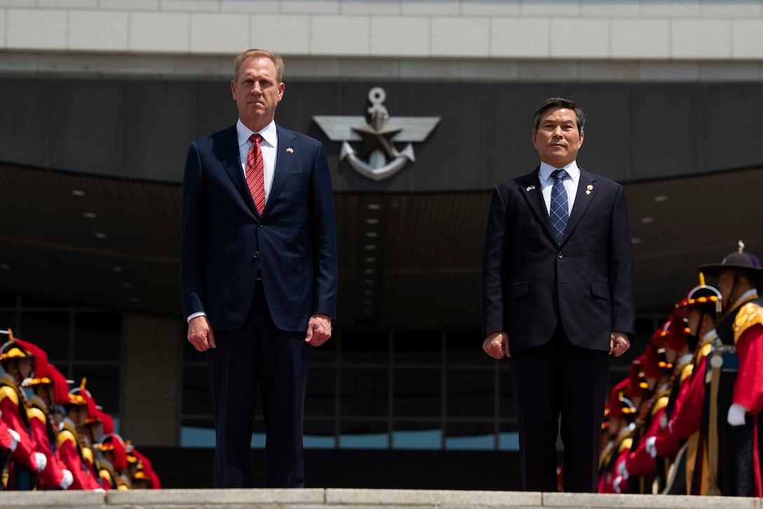 Acting Defense Secretary Patrick M. Shanahan stands next to South Korean Defense Minister Jeong Kyeong-doo during an honor guard ceremony.