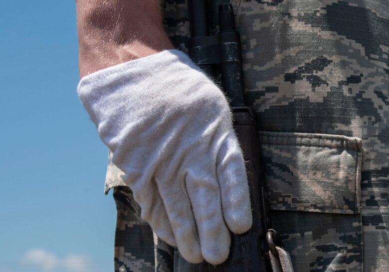 A USAF Airman stands with his weapon during a mock funeral at Shaw Air Force Base, S.C., May 21, 2019.