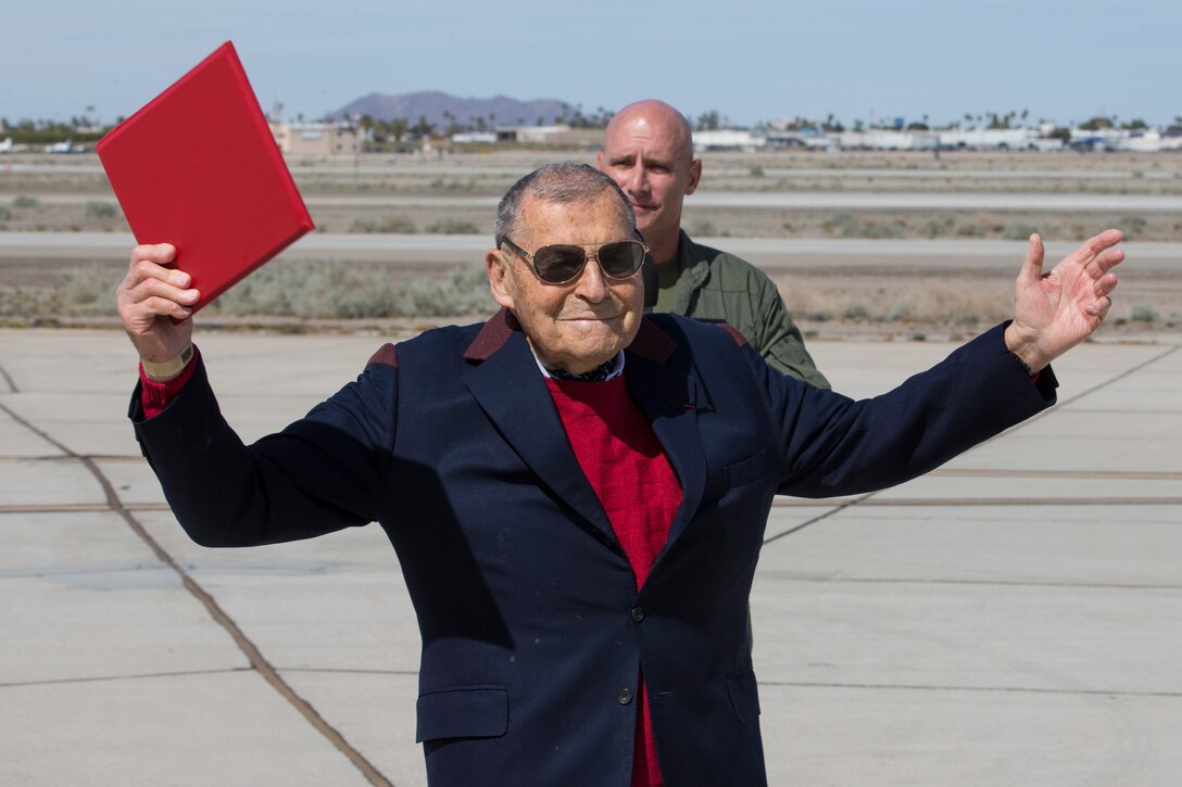 U.S. Marine Corps Col. David A. Suggs, Commanding Officer Marine Corps Air Station(MCAS) Yuma presents Jacque-Andre Istel "Mayor of Felicity", with the 2019 Yuma Airshow honorary Air Boss award at MCAS Yuma, Ariz., Saturday, March 9, 2019. The airshow is MCAS Yuma's only military airshow of the year and provides the community an opportunity to see thrilling aerial and ground performers for free while interacting with Marines and Sailors. (U.S. Marine Corps photo by Pfc. John Hall)