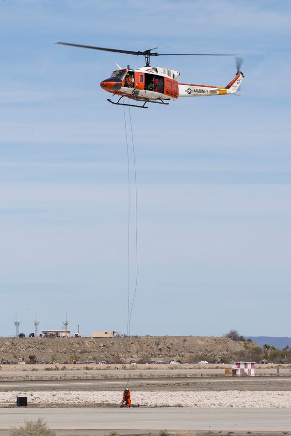 Marine Corps Air Station(MCAS) Yuma, Ariz., Search and Rescue HH-1N "Huey" displays their capabilities during the 2019 Yuma Airshow Saturday March 9, 2019. The "Huey" is used by the Marine Corps to provide all-weather, day-or-night, airborne command, control and coordination for assault support operations. Additionally, it is used for assault transportation and maritime special operations, forward air control, aeromedical evacuation of causualties from the field and tactical recovery of aircraft and personnel missions. The airshow is MCAS Yuma's only military airshow of the year and provides the community an opportunity to see thrilling aerial and ground performers for free while interacting with Marines and Sailors. (U.S. Marine Corps photo by Pfc. John Hall)