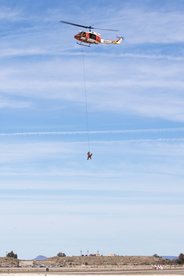 Marine Corps Air Station(MCAS) Yuma, Ariz., Search and Rescue HH-1N "Huey" displays their capabilities during the 2019 Yuma Airshow Saturday March 9, 2019. The "Huey" is used by the Marine Corps to provide all-weather, day-or-night, airborne command, control and coordination for assault support operations. Additionally, it is used for assault transportation and maritime special operations, forward air control, aeromedical evacuation of causualties from the field and tactical recovery of aircraft and personnel missions. The airshow is MCAS Yuma's only military airshow of the year and provides the community an opportunity to see thrilling aerial and ground performers for free while interacting with Marines and Sailors. (U.S. Marine Corps photo by Pfc. John Hall)