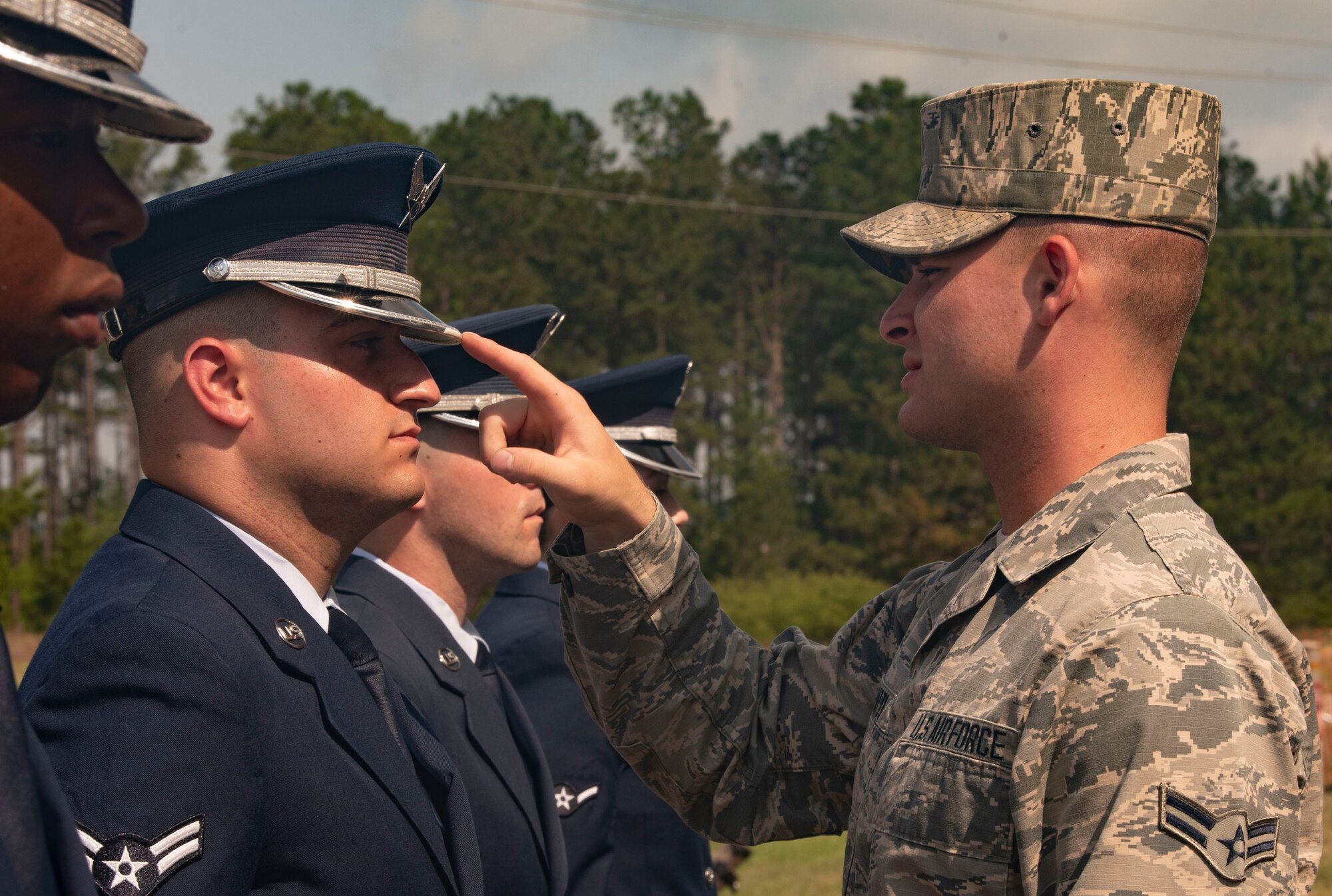 Airman 1st Class Connor Camatti, United State Air Force Honor Guard ceremonial guardsman, inspects Honor Guard trainees at Shaw Air Force Base, S.C., May 21, 2019.