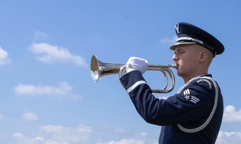 U.S. Air Force Senior Airman Jeremy Sherman, 79th Aircraft Maintenance Unit F-16CM Viper tactical aircraft maintainer, plays the bugle during a mock funeral at Shaw Air Force Base, S.C., May 22, 2019.