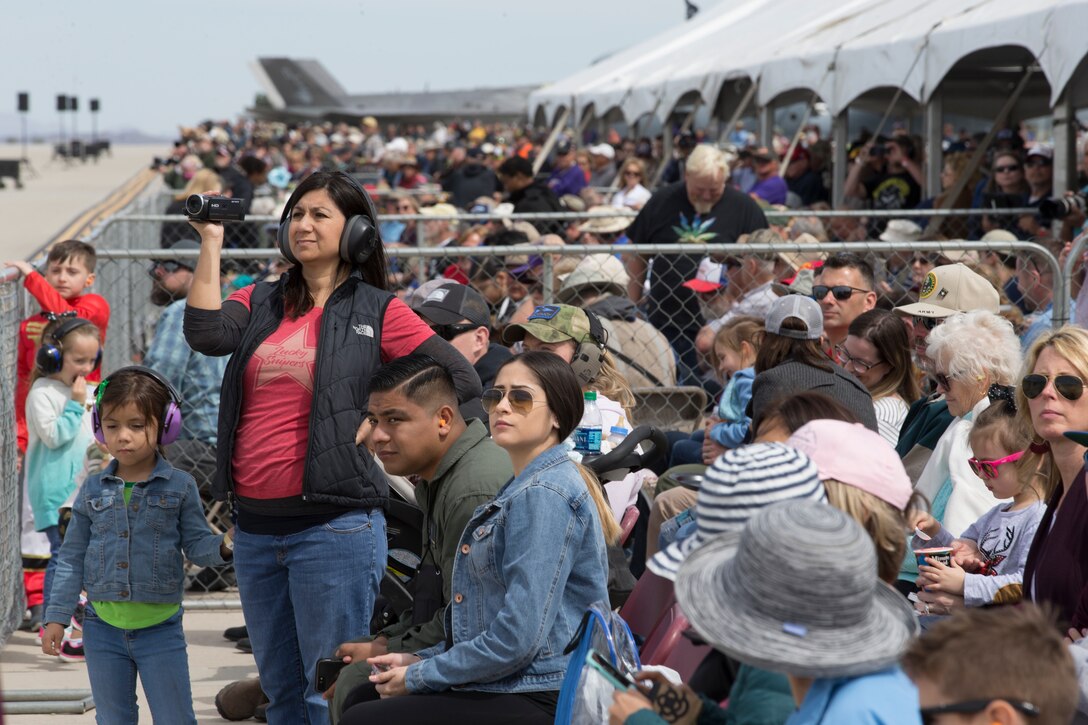 Spectators at the 2019 Yuma Airshow watch aerial demonstrations conducted by airshow performers at Marine Corps Air Station(MCAS) Yuma, Ariz., Saturday March 18, 2019. The airshow is MCAS Yuma's only military airshow of the year and provides the community an opportunity to see thrilling aerial and ground perfromers for free while interacting with Marines and Sailors. (U.S. Marine Corps photo by Pfc. John Hall)
