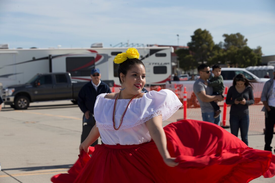 Students with Kofa High School perform folkloric dances at the 2019 Yuma Airshow hosted by Marine Corps Air Station(MCAS) Yuma Ariz., Saturday, March 9, 2019. The airshow is MCAS Yuma's only military airshow of the year and provides the community an opportunity to see thrilling aerial and ground performers for free while interacting with Marines and Sailors. (U.S. Marine Corps photo by Pfc. John Hall)