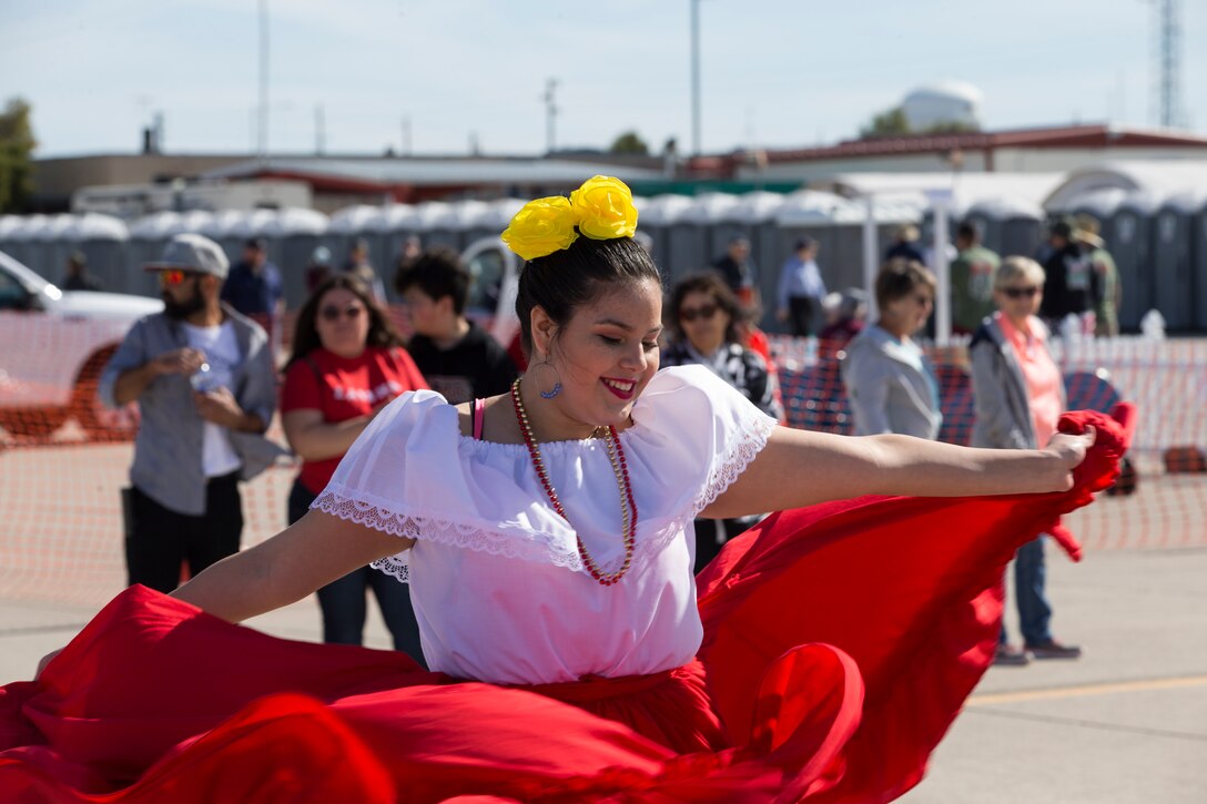 Students with Kofa High School perform folkloric dances at the 2019 Yuma Airshow hosted by Marine Corps Air Station(MCAS) Yuma Ariz., Saturday, March 9, 2019. The airshow is MCAS Yuma's only military airshow of the year and provides the community an opportunity to see thrilling aerial and ground performers for free while interacting with Marines and Sailors. (U.S. Marine Corps photo by Pfc. John Hall)