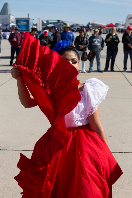 Students with Kofa High School perform folkloric dances at the 2019 Yuma Airshow hosted by Marine Corps Air Station(MCAS) Yuma Ariz., Saturday, March 9, 2019. The airshow is MCAS Yuma's only military airshow of the year and provides the community an opportunity to see thrilling aerial and ground performers for free while interacting with Marines and Sailors. (U.S. Marine Corps photo by Pfc. John Hall)