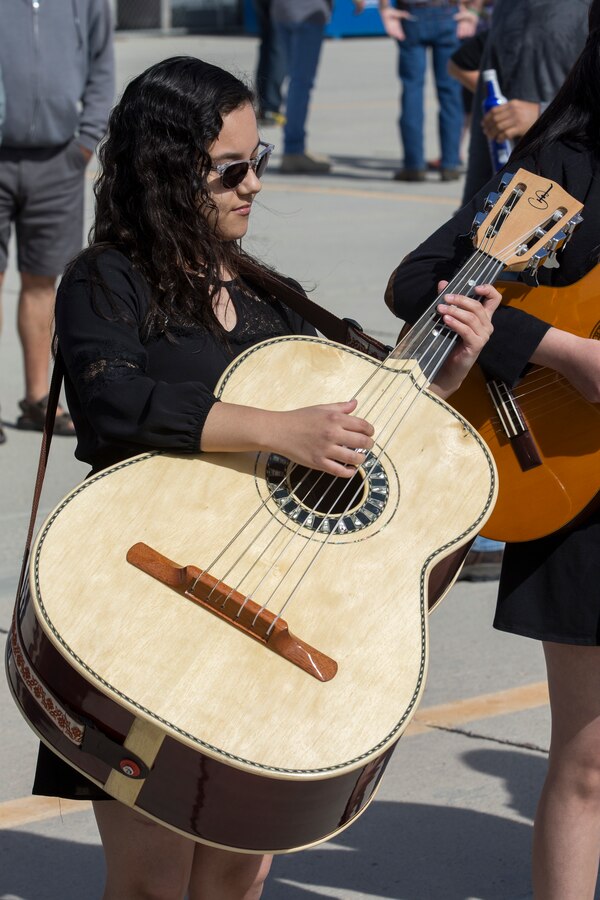 Students with San Luis High School Mariachi Band perform at the 2019 Yuma Airshow hosted by Marine Corps Air Station(MCAS) Yuma Ariz., Saturday, March 9, 2019. The airshow is MCAS Yuma's only military airshow of the year and provides the community an opportunity to see thrilling aerial and ground performers for free while interacting with Marines and Sailors. (U.S. Marine Corps photo by Pfc. John Hall)
