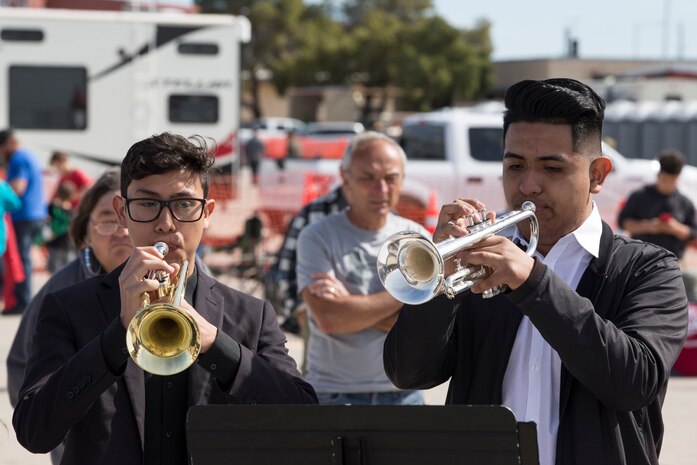 Students with San Luis High School Mariachi Band perform at the 2019 Yuma Airshow hosted by Marine Corps Air Station(MCAS) Yuma Ariz., Saturday, March 9, 2019. The airshow is MCAS Yuma's only military airshow of the year and provides the community an opportunity to see thrilling aerial and ground performers for free while interacting with Marines and Sailors. (U.S. Marine Corps photo by Pfc. John Hall)