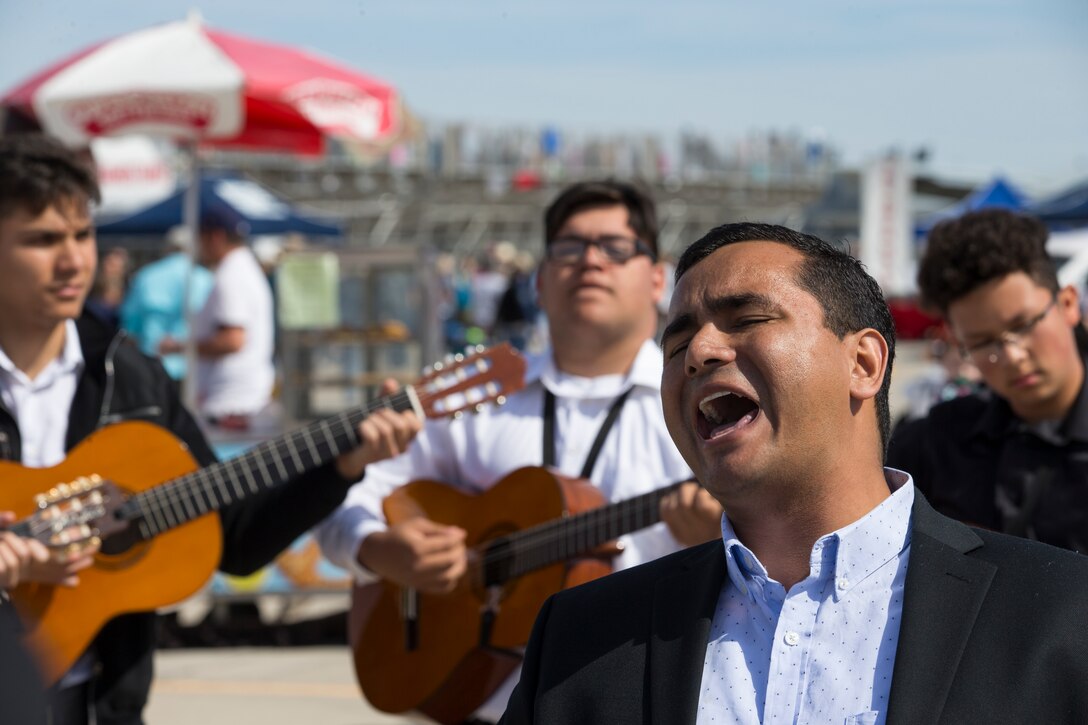 Students with San Luis High School Mariachi Band perform at the 2019 Yuma Airshow hosted by Marine Corps Air Station(MCAS) Yuma Ariz., Saturday, March 9, 2019. The airshow is MCAS Yuma's only military airshow of the year and provides the community an opportunity to see thrilling aerial and ground performers for free while interacting with Marines and Sailors. (U.S. Marine Corps photo by Pfc. John Hall)