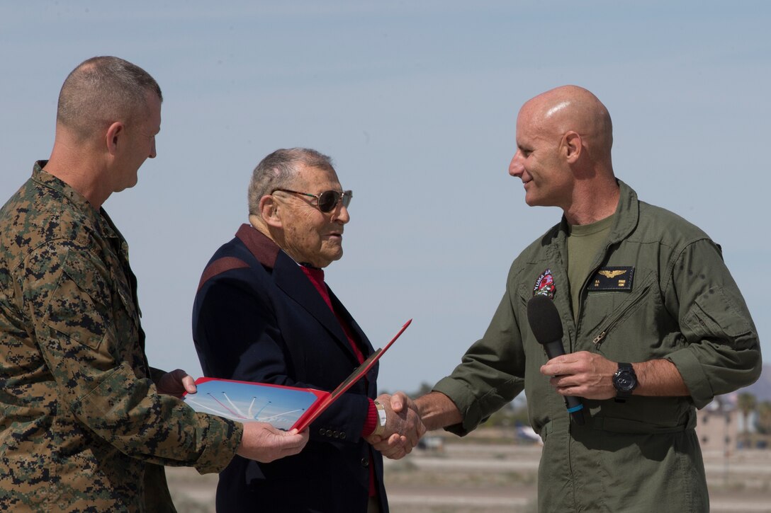 U.S. Marine Corps Col. David A. Suggs, Commanding Officer Marine Corps Air Station(MCAS) Yuma presents Jacque-Andre Istel "Mayor of Felicity", with the 2019 Yuma Airshow honorary Air Boss award at MCAS Yuma, Ariz., Saturday, March 9, 2019. The airshow is MCAS Yuma's only military airshow of the year and provides the community an opportunity to see thrilling aerial and ground performers for free while interacting with Marines and Sailors. (U.S. Marine Corps photo by Pfc. John Hall)