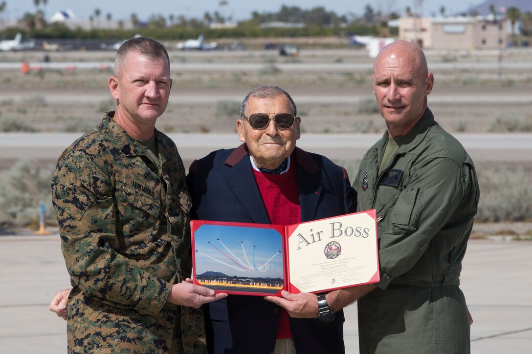 U.S. Marine Corps Col. David A. Suggs, Commanding Officer Marine Corps Air Station(MCAS) Yuma presents Jacque-Andre Istel "Mayor of Felicity", with the 2019 Yuma Airshow honorary Air Boss award at MCAS Yuma, Ariz., Saturday, March 9, 2019. The airshow is MCAS Yuma's only military airshow of the year and provides the community an opportunity to see thrilling aerial and ground performers for free while interacting with Marines and Sailors. (U.S. Marine Corps photo by Pfc. John Hall)