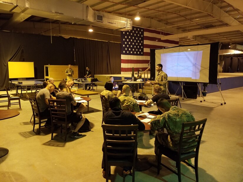 Soldiers from 1st Battalion, 114th Infantry Regiment, New Jersey Army National Guard listen to a briefing about the Ranger School Orientation Program at Camp As Sayliyah, Qatar. The 1st Bn., 114th Inf. Reg. serves as the security forces element for Area Support Group-Qatar and conducts this program to help prepare its Soldiers for advanced schools.