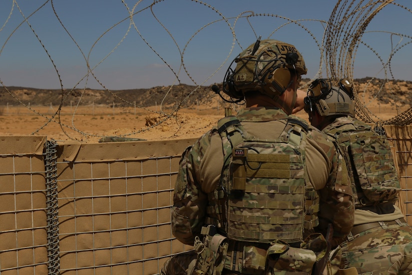 U.S. Airmen 2nd Lt. Alec Fetzer and Staff Sgt. Garrett Valosek oversee an area where they conducted a fires mission in Jordan during an emergency deployment readiness exercise on May 3-10, 2019. The airmen are the United States Air Force tactical air control party attached to the division for the exercise and were able to provide the air to ground communication for fires missions.  The purpose of this exercise is to set up a tactical command post and demonstrate the ability to perform command and control from a forward deployed location. The 82nd Expeditionary Air Support Operations Squadron is supporting U.S. Central Command’s Task Force Spartan throughout the area of responsibility.