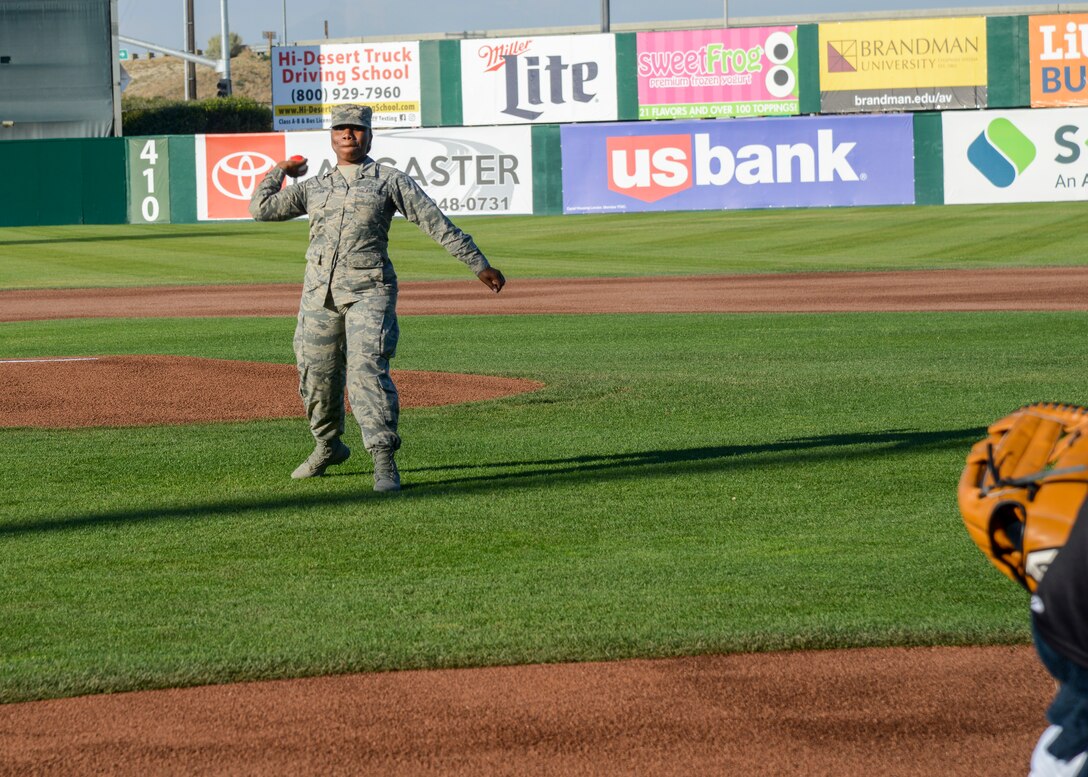 Senior Airman Mutia Graham, 412th Aerospace Medicine Squadron, throws the ceremonial first pitch during the Lancaster Jethawk's Aerospace Appreciation Night, at the Hangar baseball stadium in Lancaster, Calif., May 31. (U.S. Air Force photo by Giancarlo Casem)