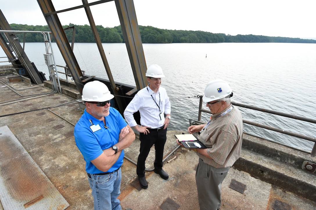 Dick Nugent, right, the Safety, Health and Environment manager for National Aerospace Solutions, the Test Operations and Sustainment contractor at Arnold Air Force Base, conducts a safety walk with former NAS Integrated Resources Director Ben Souther, center, and Arnold AFB Cooling Water Supervisor Bob Thomas at the Woods Reservoir Primary Pumping Station in 2017. Nugent was recently named an American Society of Safety Professionals Fellow, regarded as one of the highest honors in the safety profession. (U.S. Air Force photo by Rick Goodfriend) (This image was altered by obscuring badges for security purposes)