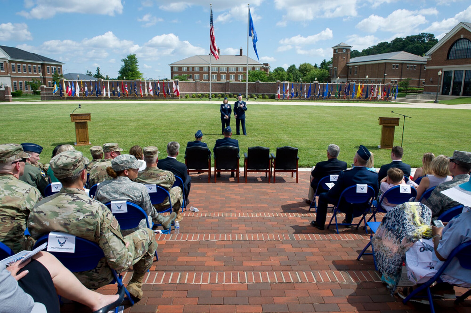 Chief Master Sgts. Melanie K. Noel, Air Force District of Washington command chief, left, and Michael D. Noel, Senior Enlisted Advisor to the Assistant to the Secretary of Defense for Public Affairs, speak to guests during their combined retirement ceremony at Joint Base Anacostia-Bolling, Washington, D.C., May 31, 2019. (U.S. Air Force photo by Master Sgt. Michael B. Keller)